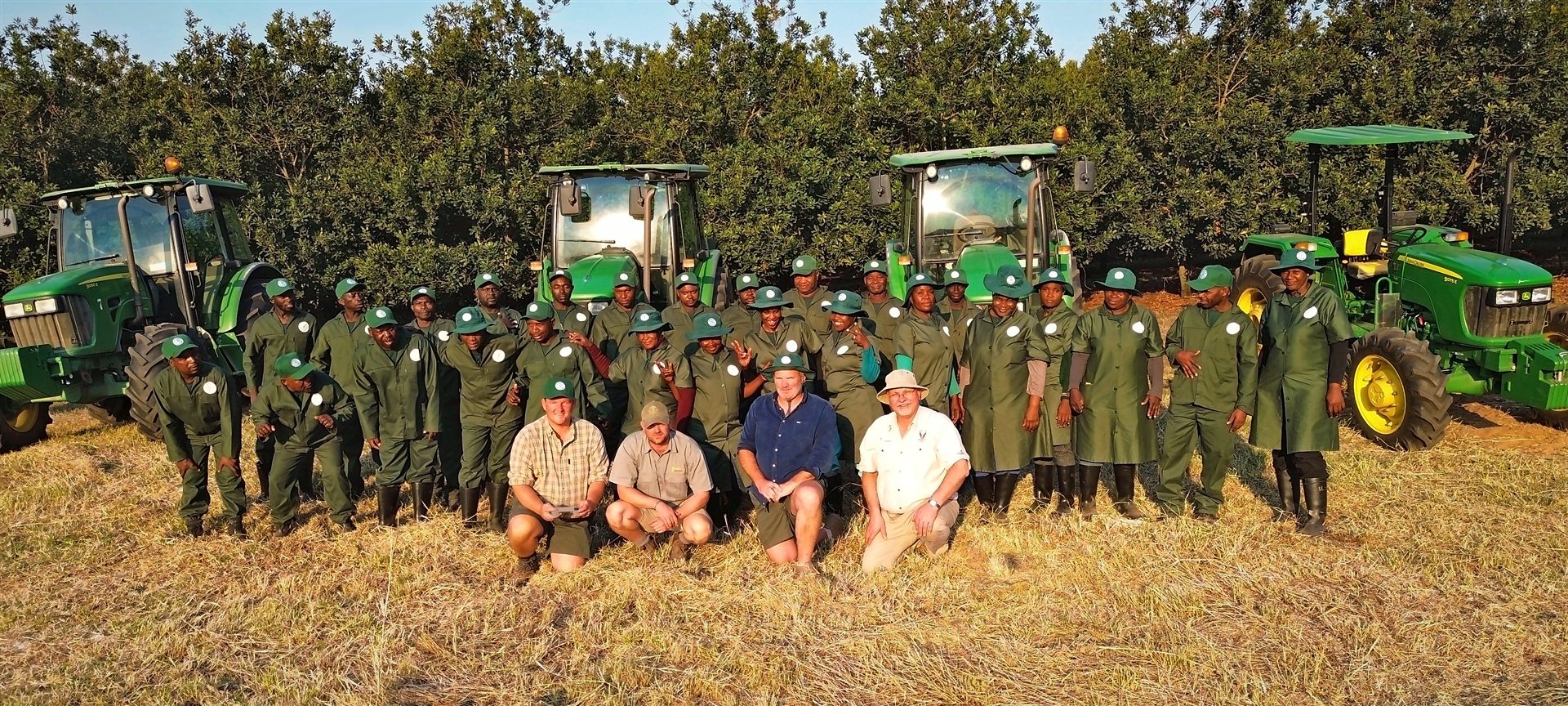 The Sunstone Valley crew and tractor fleet in the macadamia orchard